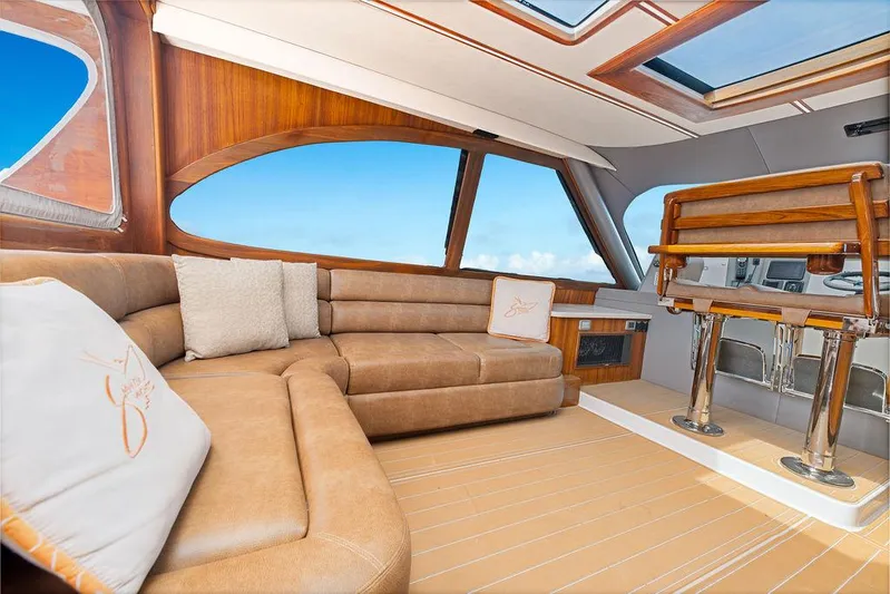 Jet Stream Yacht Photos Pics Luxurious interior of 2018 Spencer Yachts Jet Boat with plush seating and wooden accents.