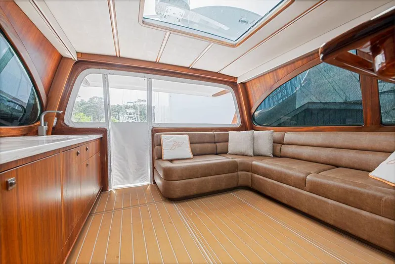 Jet Stream Yacht Photos Pics Luxurious interior of 2018 Spencer Yachts Jet Boat with leather seating and wood finish.