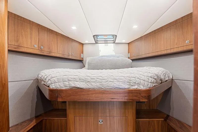 Jet Stream Yacht Photos Pics Luxurious cabin interior of 2018 Spencer Yachts Jet Boat with cozy bed and wooden finish.