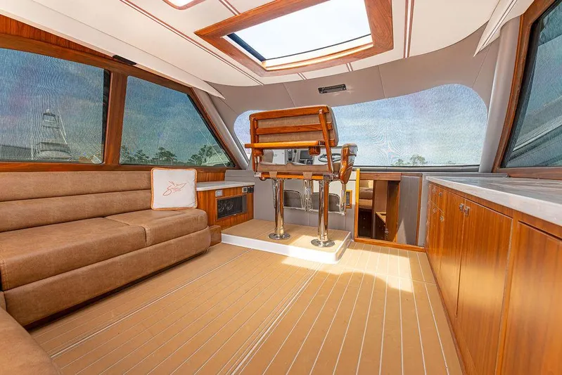 Jet Stream Yacht Photos Pics Luxurious interior of 2018 Spencer Yachts Jet Boat with plush seating and wooden accents.