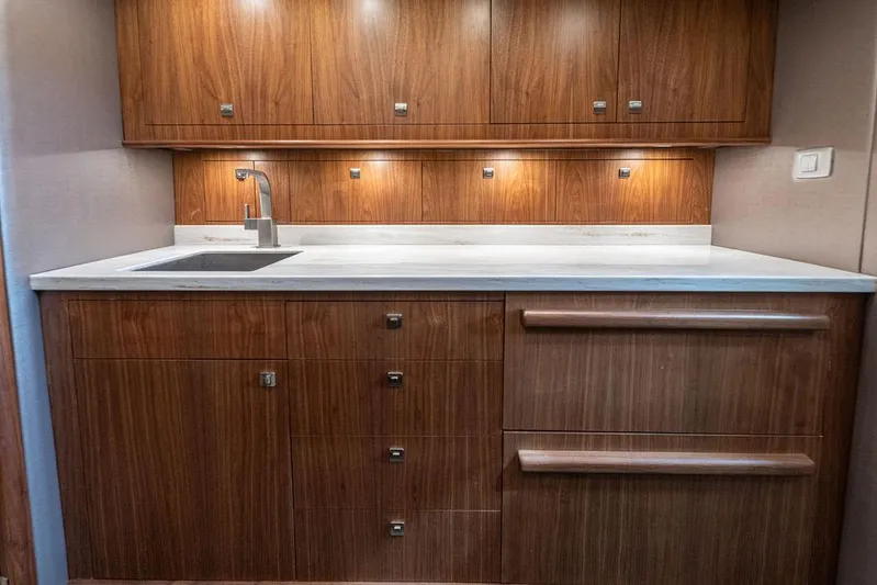 Jet Stream Yacht Photos Pics Luxurious wooden yacht kitchen interior with modern sink and cabinetry, Spencer Yachts JET BOAT 2018.