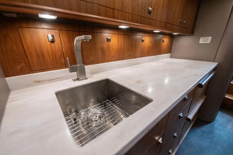 Jet Stream Yacht Photos Pics Luxurious yacht kitchen with modern sink and wooden cabinetry, Spencer Yachts JET BOAT 2018.