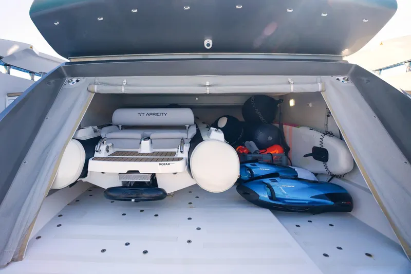 Apricity Yacht Photos Pics 2024 Azimut S8 yacht storage with inflatable boat and water sports equipment.