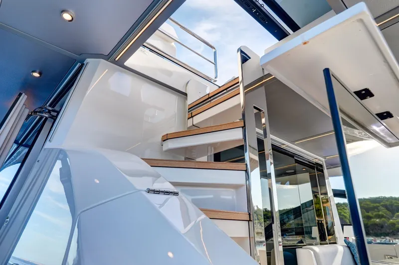 Apricity Yacht Photos Pics Luxurious interior staircase of 2024 Azimut S8 yacht, featuring sleek design and modern finishes.