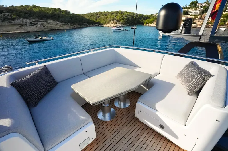 Apricity Yacht Photos Pics Luxurious 2024 Azimut S8 yacht deck with elegant seating and scenic ocean view.