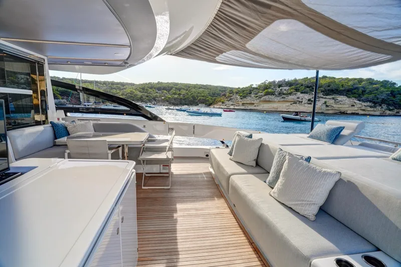 Apricity Yacht Photos Pics Luxurious 2024 Azimut S8 yacht deck with elegant seating and scenic ocean view.