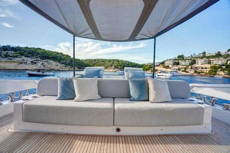 Apricity Yacht Photos Pics Luxurious 2024 Azimut S8 yacht deck with comfortable seating and scenic coastal view.