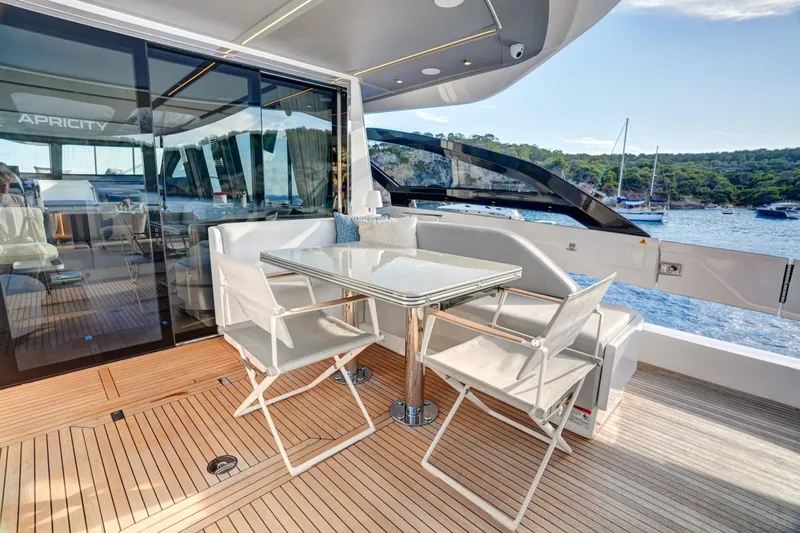 Apricity Yacht Photos Pics 2024 Azimut S8 yacht deck with elegant seating and scenic ocean view.