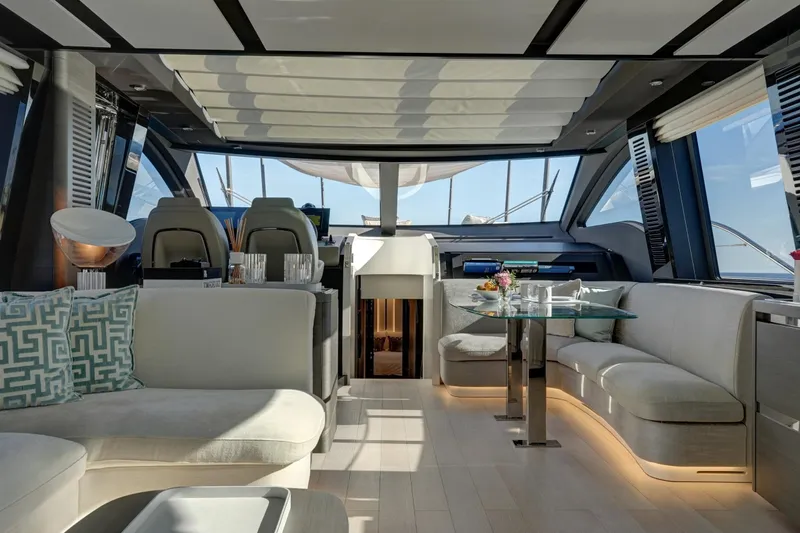 Apricity Yacht Photos Pics Luxurious interior of 2024 Azimut S8 yacht with modern seating and dining area.