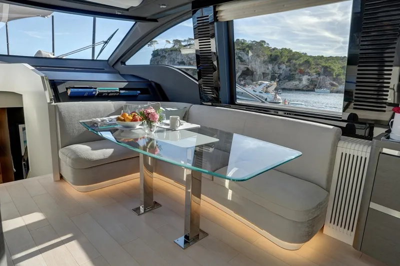 Apricity Yacht Photos Pics Luxurious interior of 2024 Azimut S8 yacht with elegant dining area and scenic ocean view.