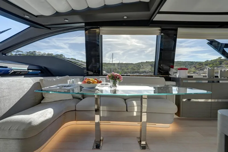Apricity Yacht Photos Pics Luxurious interior of 2024 Azimut S8 yacht with elegant seating and glass table.