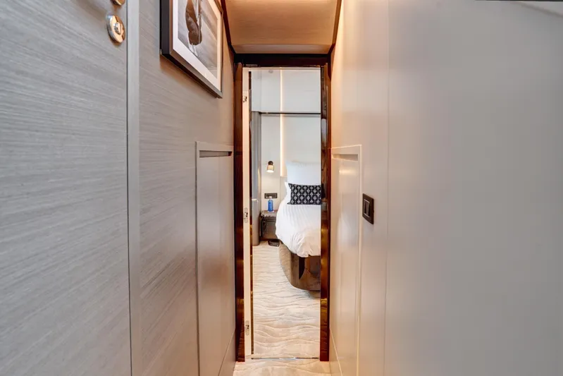Apricity Yacht Photos Pics Luxurious interior hallway leading to a bedroom on the 2024 Azimut S8 yacht.