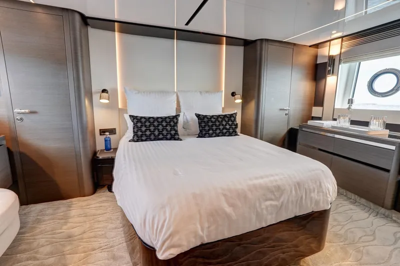Apricity Yacht Photos Pics Luxurious bedroom interior of 2024 Azimut S8 yacht with modern design and elegant furnishings.