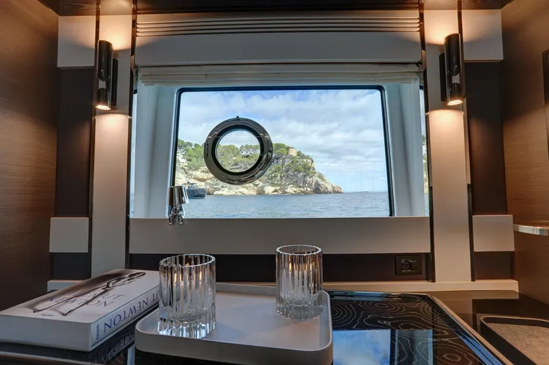 Apricity Yacht Photos Pics Luxurious interior of 2024 Azimut S8 yacht with ocean view through window.