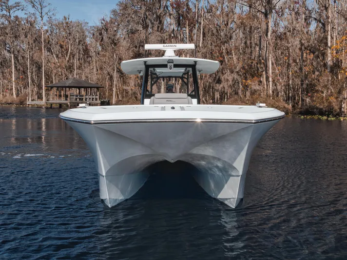  Yacht Photos Pics 2026 Front Runner 37 Catamaran on serene lake with wooded backdrop.