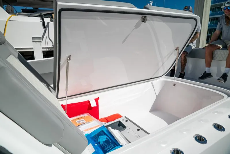  Yacht Photos Pics Open storage compartment on 2026 Front Runner 37 Catamaran, showcasing spacious interior and accessories.