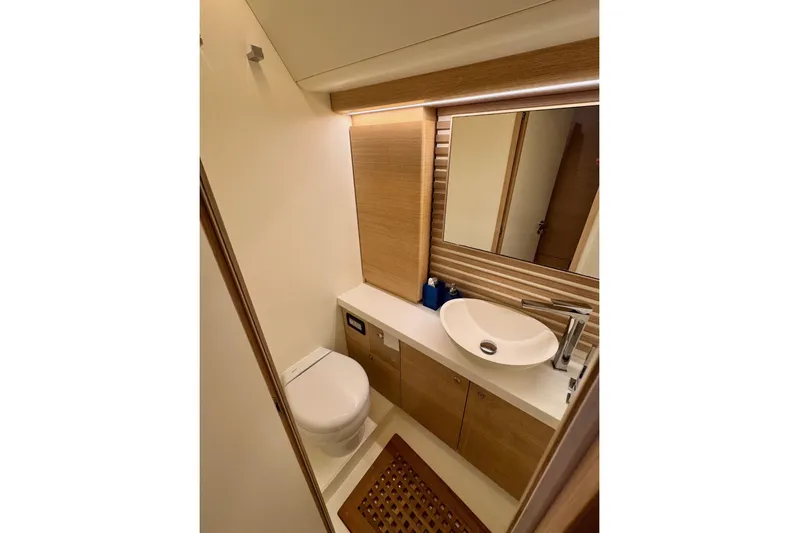  Yacht Photos Pics Luxurious bathroom in 2021 Italia Yachts 15.98 with modern fixtures and elegant design.