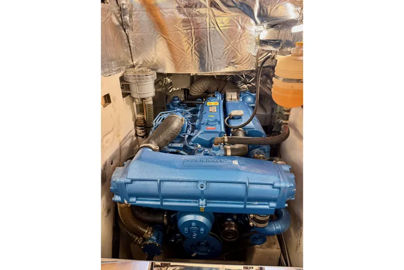  Yacht Photos Pics Engine compartment of 2021 Italia Yachts 15.98, featuring a blue marine engine.