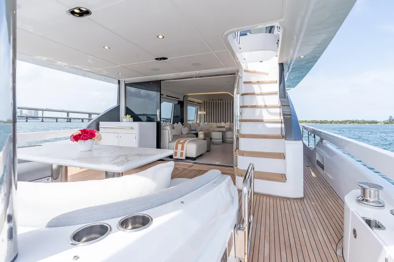 Euphoria Yacht Photos Pics Luxurious 2022 Azimut 78 yacht interior with elegant seating and ocean view.