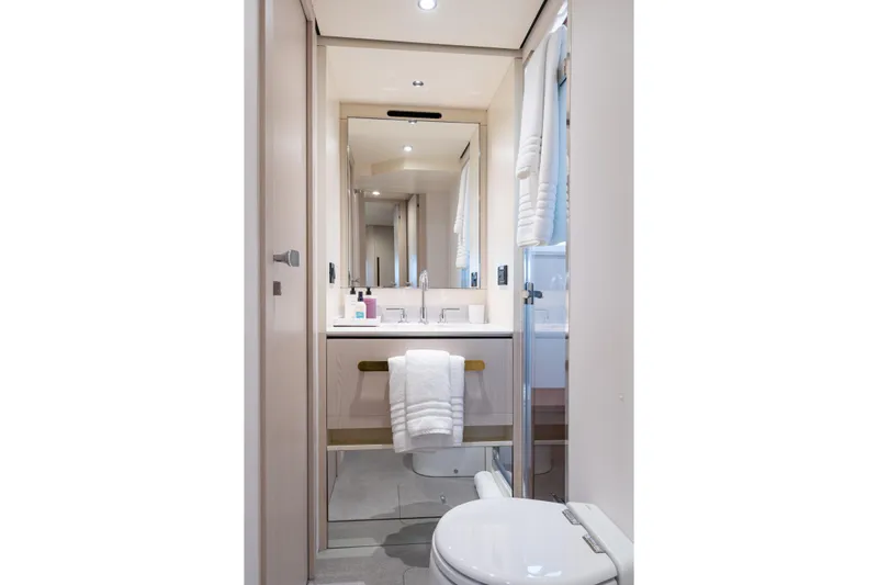 Euphoria Yacht Photos Pics Luxurious bathroom in 2022 Azimut 78 yacht, featuring modern fixtures and elegant design.