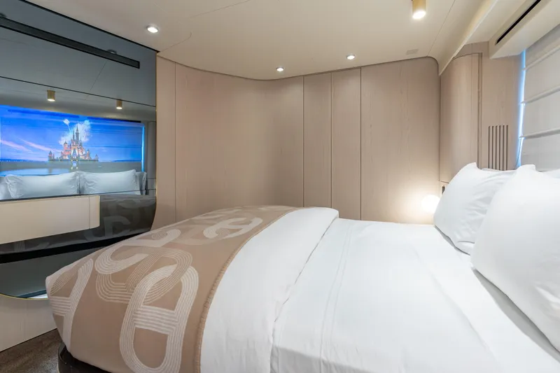 Euphoria Yacht Photos Pics Luxurious bedroom interior of 2022 Azimut 78 yacht with elegant bedding and ambient lighting.