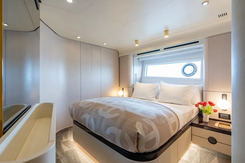 Euphoria Yacht Photos Pics Luxurious bedroom interior of 2022 Azimut 78 yacht with modern design and elegant decor.
