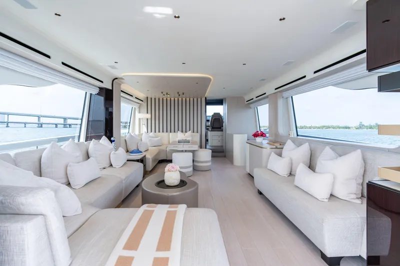 Euphoria Yacht Photos Pics Luxurious interior of 2022 Azimut 78 yacht with elegant seating and panoramic windows.