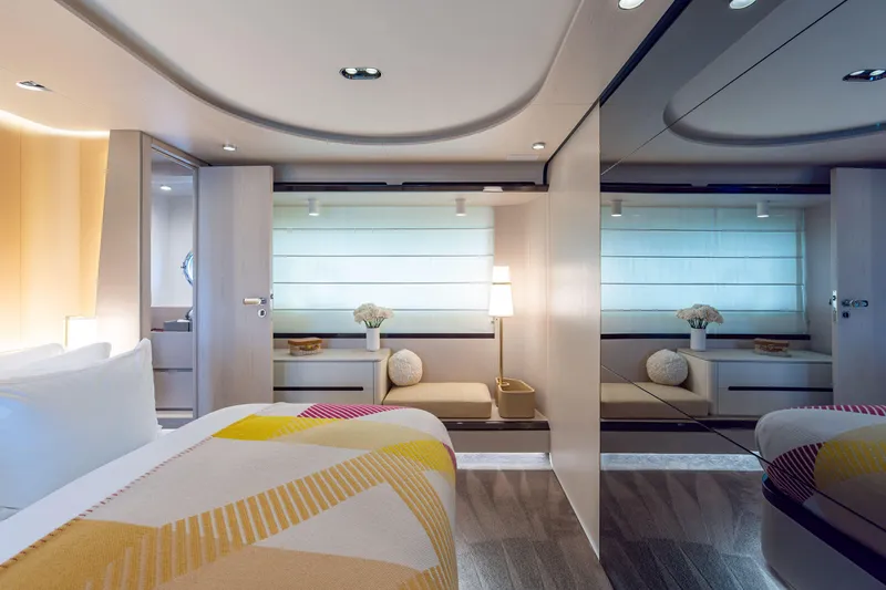 Euphoria Yacht Photos Pics Luxurious interior of 2022 Azimut 78 yacht, featuring modern bedroom design and elegant decor.