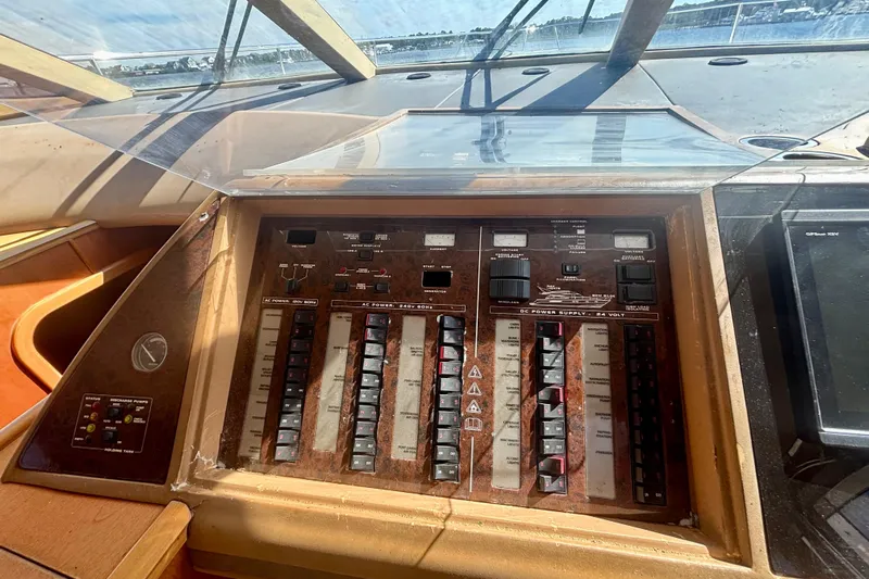  Yacht Photos Pics Control panel of a 2004 Viking Princess 61 Fly Bridge yacht, featuring various switches and dials.