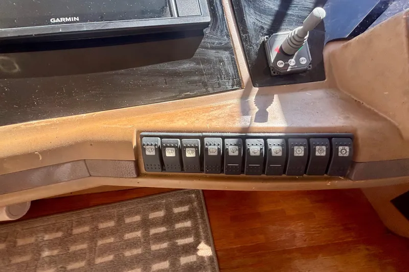  Yacht Photos Pics Control panel of 2004 Viking Princess 61 Fly Bridge with switches and Garmin display.
