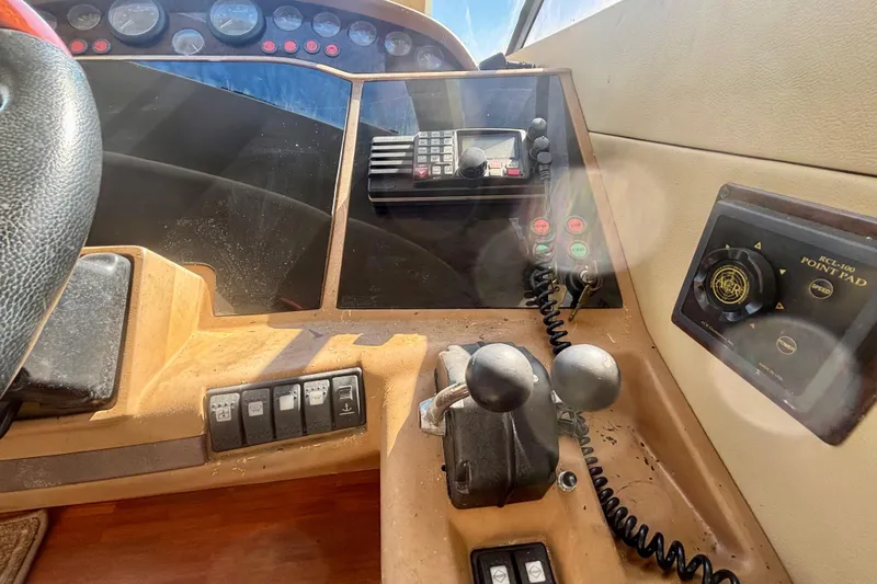  Yacht Photos Pics Control panel of a 2004 Viking Princess 61 Fly Bridge yacht, featuring navigation and communication equipment.