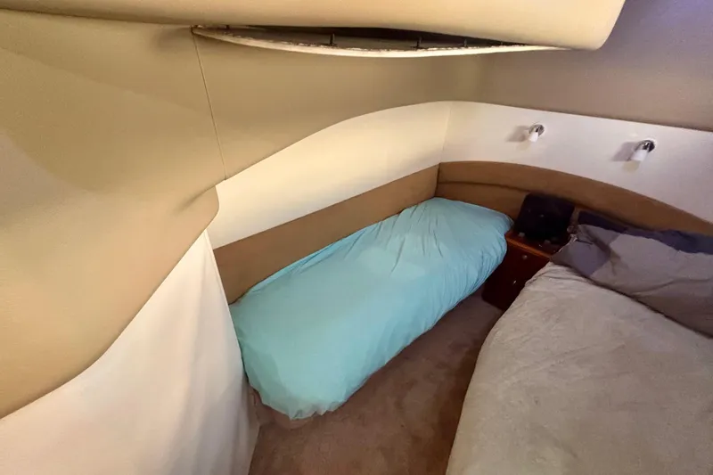  Yacht Photos Pics Interior cabin of 2004 Viking Princess 61 Fly Bridge yacht with twin beds.