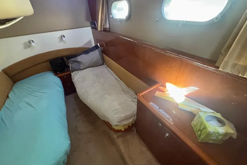  Yacht Photos Pics Interior cabin of 2004 Viking Princess 61 Fly Bridge yacht with twin beds.