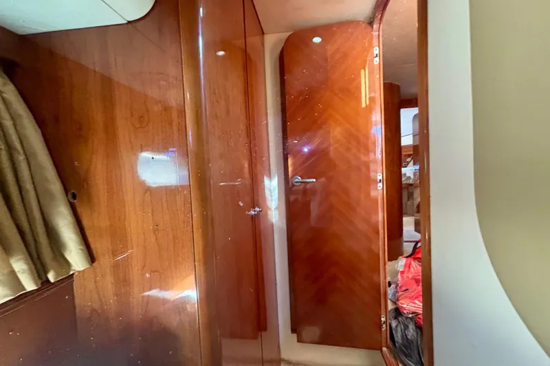  Yacht Photos Pics Interior of 2004 Viking Princess 61 Fly Bridge yacht with wooden doors and elegant design.