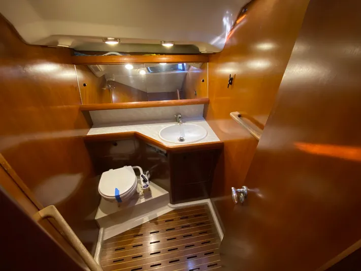 Cavallino Yacht Photos Pics Luxurious wooden bathroom interior of 2000 Grand Soleil 46.3 yacht.
