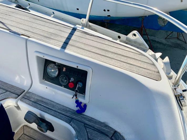 Cavallino Yacht Photos Pics Control panel of a 2000 Grand Soleil 46.3 sailboat with wooden deck details.