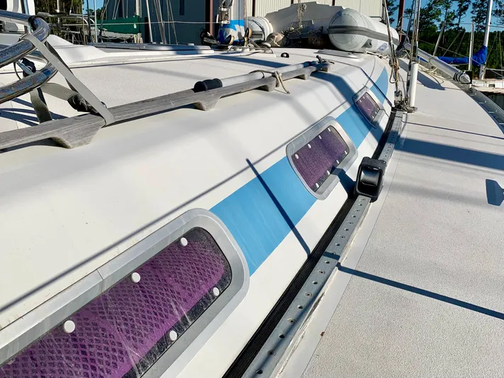 Cavallino Yacht Photos Pics Deck of a 2000 Grand Soleil 46.3 sailboat with blue accents and windows.