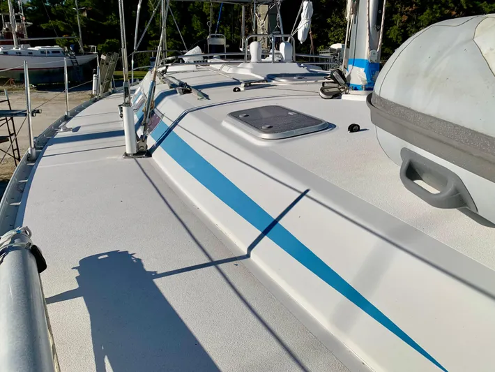 Cavallino Yacht Photos Pics Deck of 2000 Grand Soleil 46.3 sailboat with blue stripe and equipment.