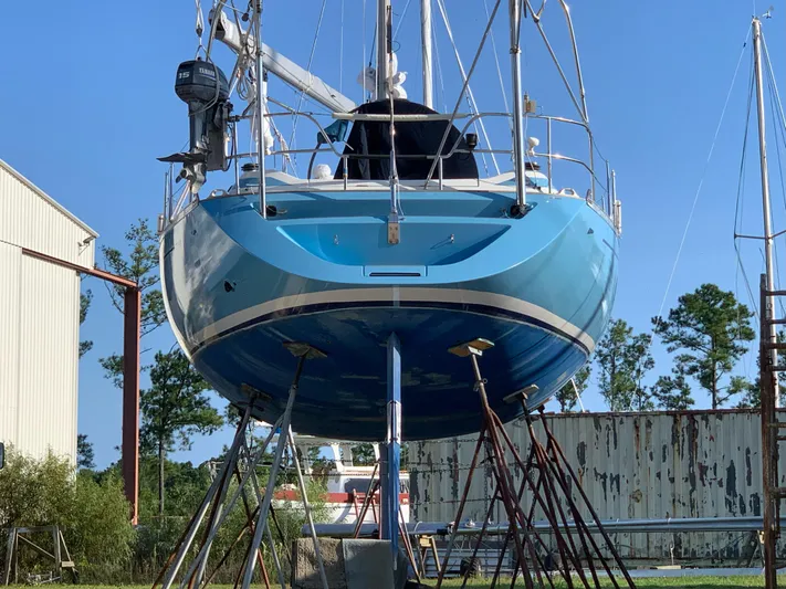 Cavallino Yacht Photos Pics Grand Soleil 46.3 sailboat from 2000 on stands, blue hull, outdoor setting.