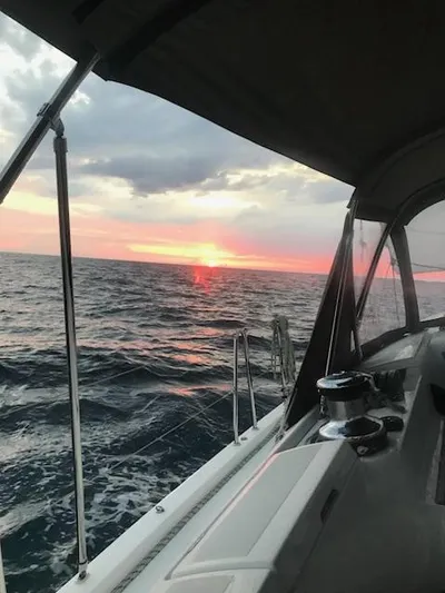  Yacht Photos Pics Jeanneau Sun Odyssey 51 sailing at sunset, 2017 model, ocean view.
