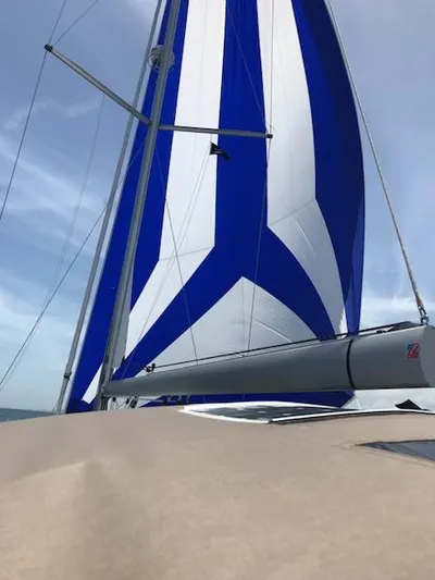  Yacht Photos Pics Jeanneau Sun Odyssey 51 sailboat with blue and white sails, 2017 model.