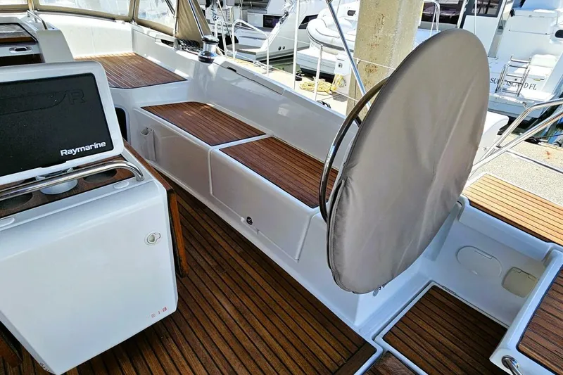  Yacht Photos Pics Cockpit of 2017 Jeanneau Sun Odyssey 51 with teak flooring and Raymarine equipment.