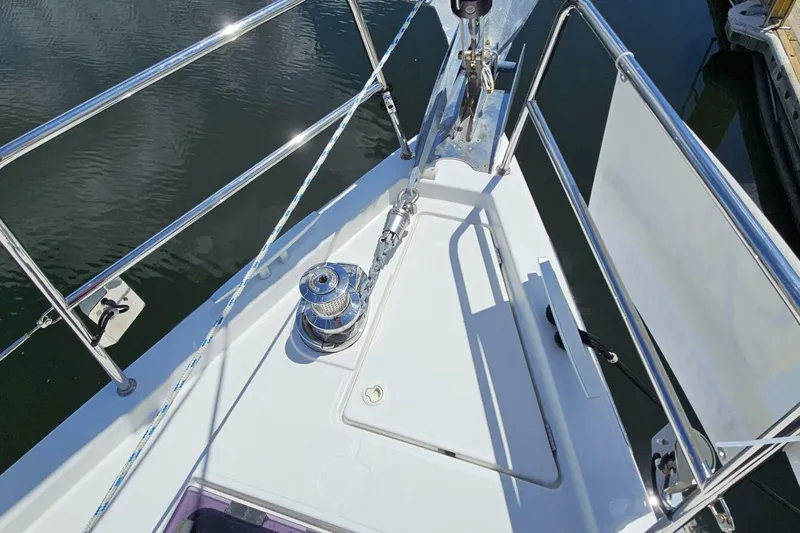  Yacht Photos Pics Bow of 2017 Jeanneau Sun Odyssey 51 sailboat with winch and railing.