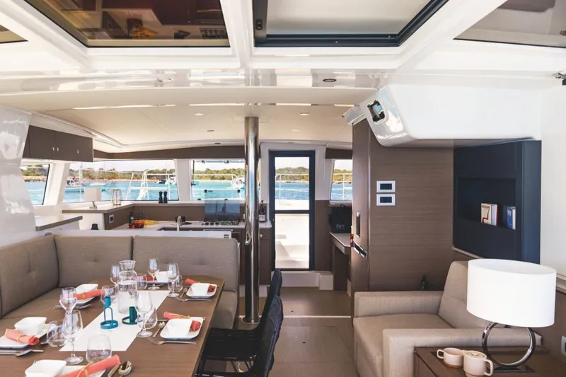 Yulia Yacht Photos Pics Luxurious interior of 2023 Bali 4.2 yacht with elegant dining area and scenic ocean view.