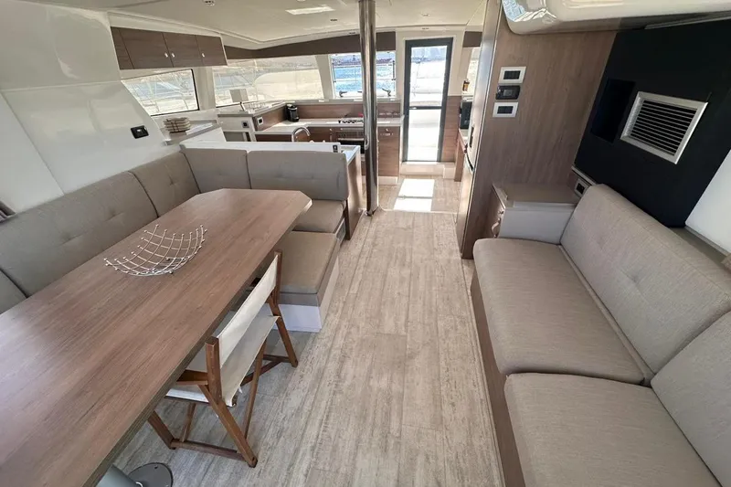 Yulia Yacht Photos Pics Modern interior of 2023 Bali 4.2 yacht with spacious seating and dining area.