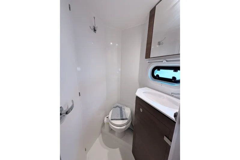 Yulia Yacht Photos Pics Modern bathroom in 2023 Bali 4.2 yacht with sleek design and compact amenities.