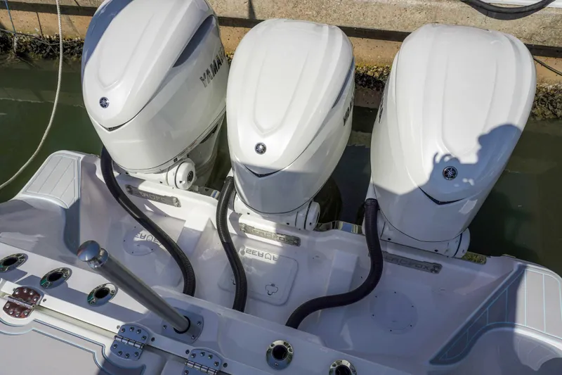 The Reel Commander Yacht Photos Pics Triple outboard engines on a 2026 Sea Fox 368 Commander boat at the dock.