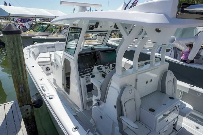 The Reel Commander Yacht Photos Pics 2026 Sea Fox 368 Commander boat with sleek design and modern cockpit at a marina.