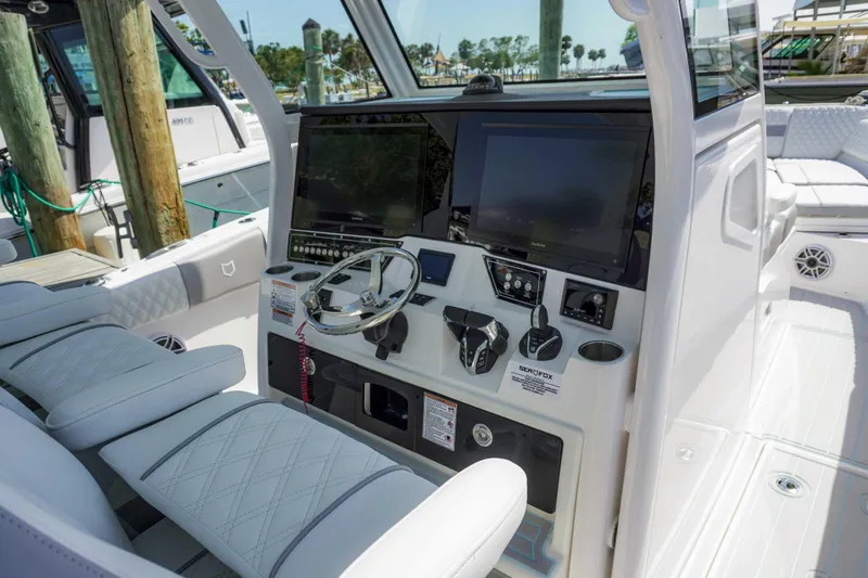 The Reel Commander Yacht Photos Pics 2026 Sea Fox 368 Commander boat cockpit with advanced navigation controls and luxurious seating.