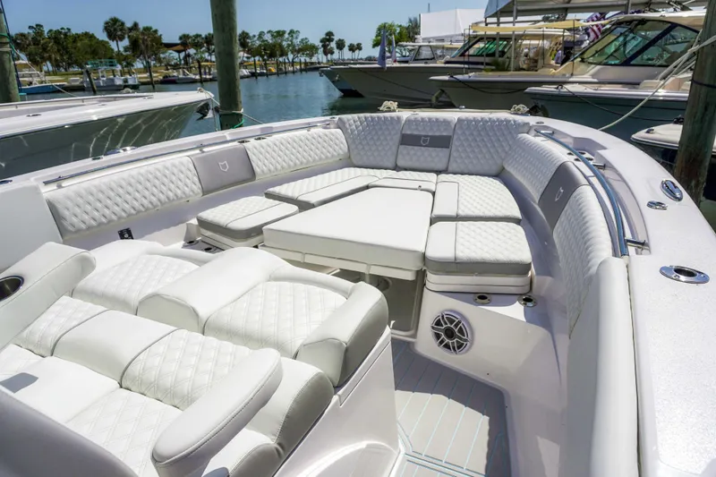 The Reel Commander Yacht Photos Pics Luxurious seating area on a 2026 Sea Fox 368 Commander boat at a marina.